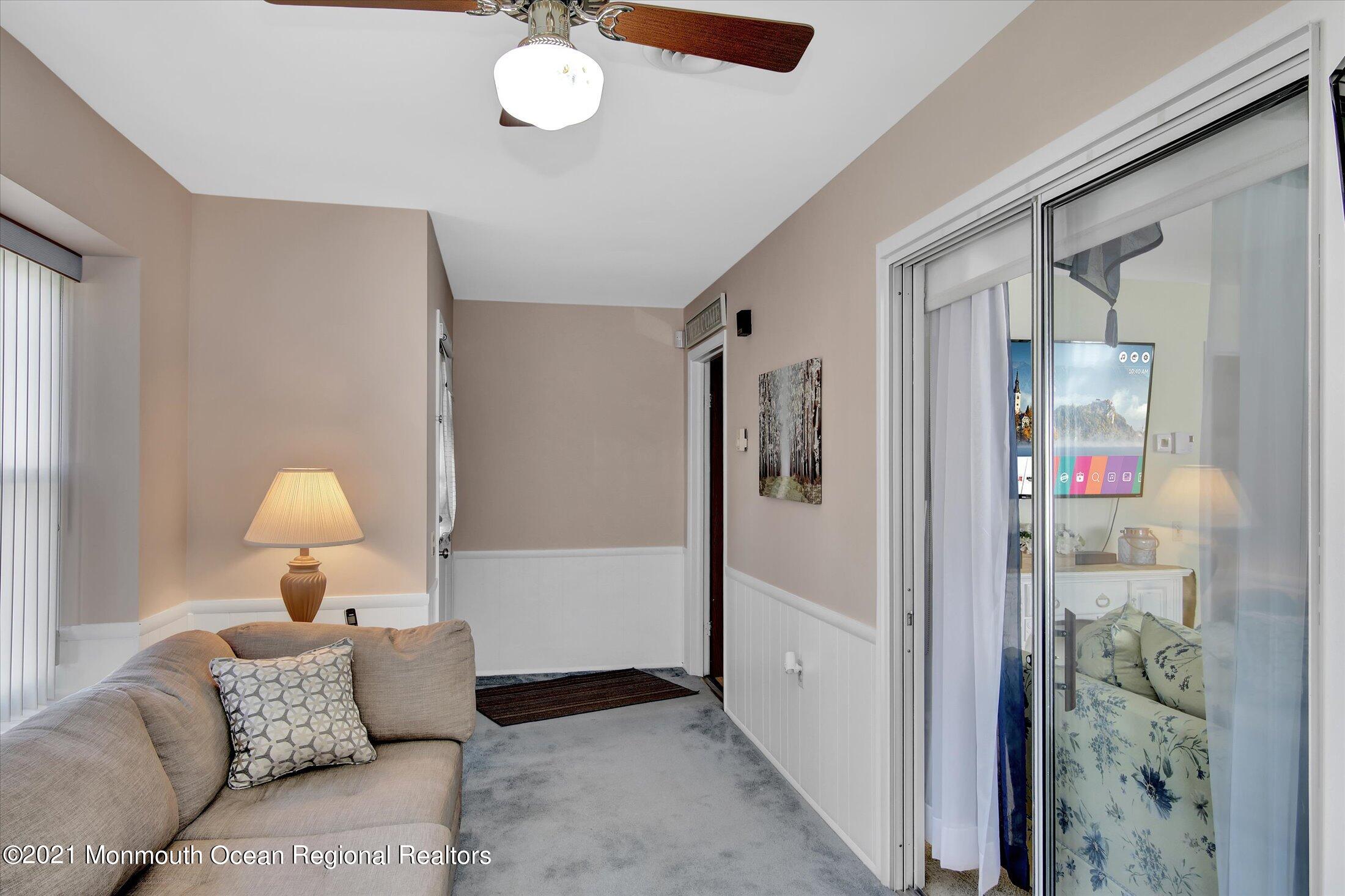 17 Ashley Road Whiting, NJ 08759 - Photo 6 of 31 a living room with furniture and a chandelier