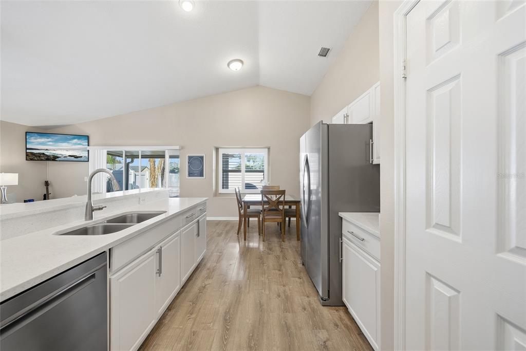 2119 Cattleman Drive Brandon, FL 33511 - Photo 14 of 46 a kitchen with a sink a counter top space and stainless steel appliances