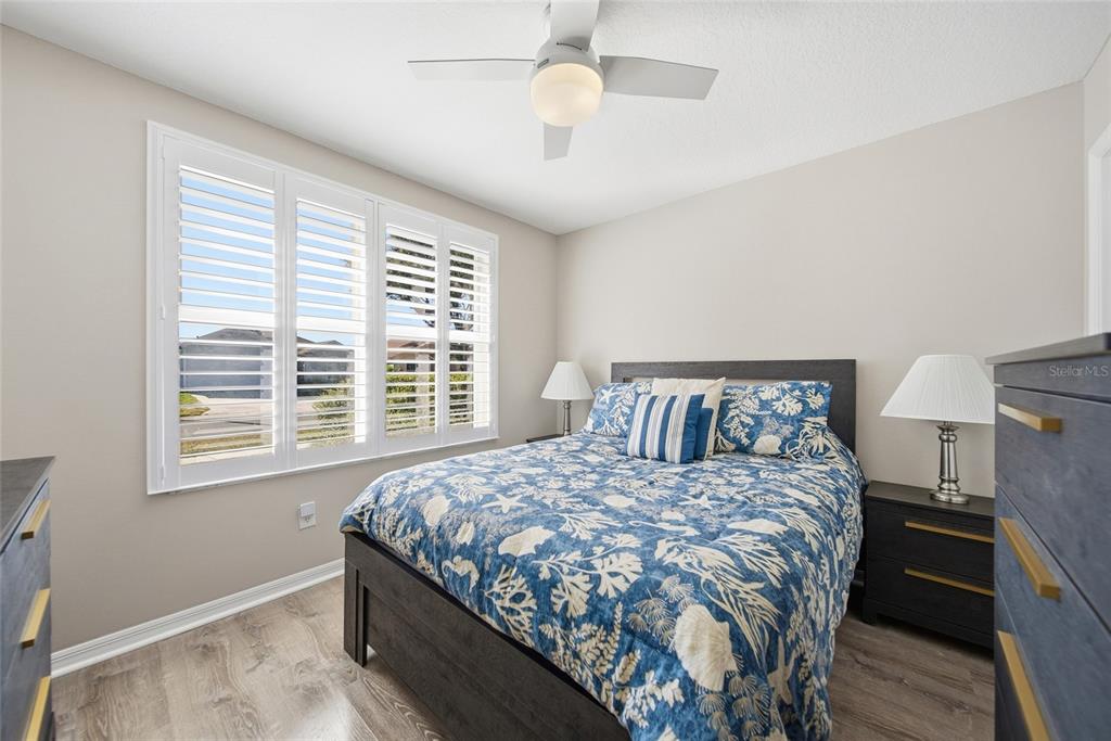 2119 Cattleman Drive Brandon, FL 33511 - Photo 16 of 46 a bedroom with a large bed and a chandelier