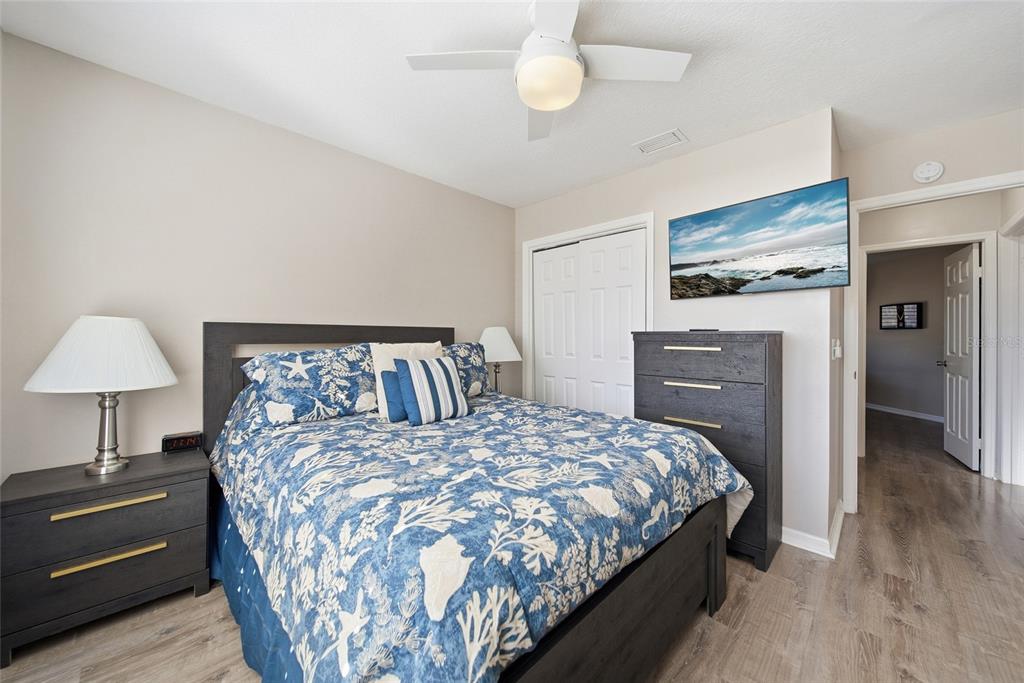 2119 Cattleman Drive Brandon, FL 33511 - Photo 17 of 46 a bedroom with a bed and a lamp