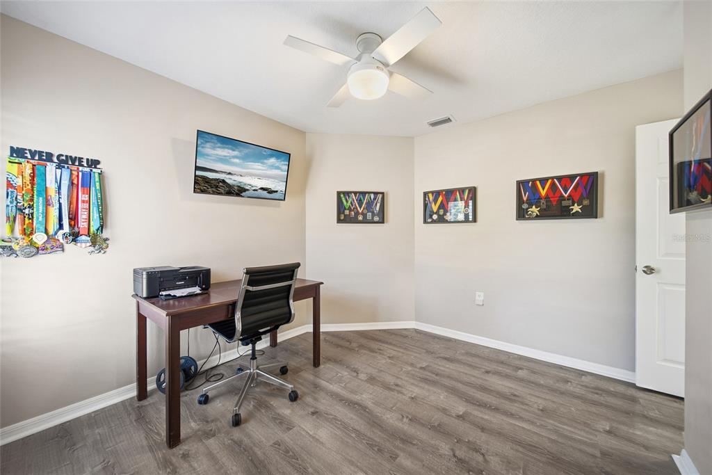 2119 Cattleman Drive Brandon, FL 33511 - Photo 21 of 46 a view of a workspace with furniture and wooden floor