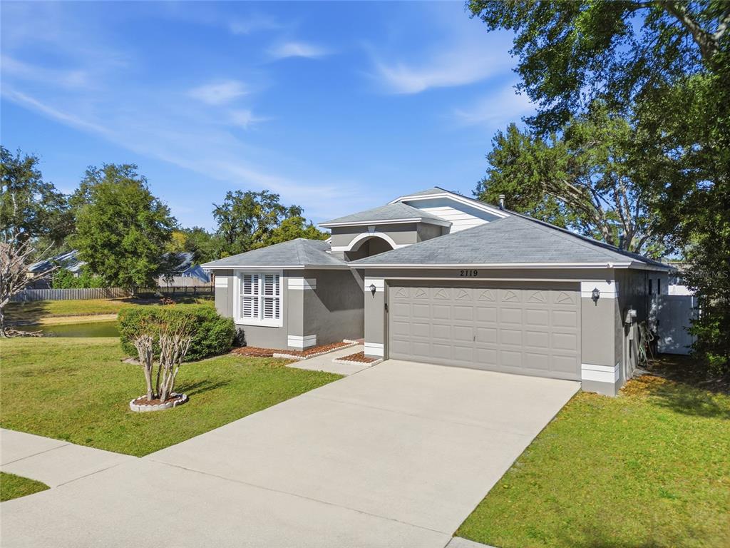 2119 Cattleman Drive Brandon, FL 33511 - Photo 3 of 46 a front view of a house with a yard and garage