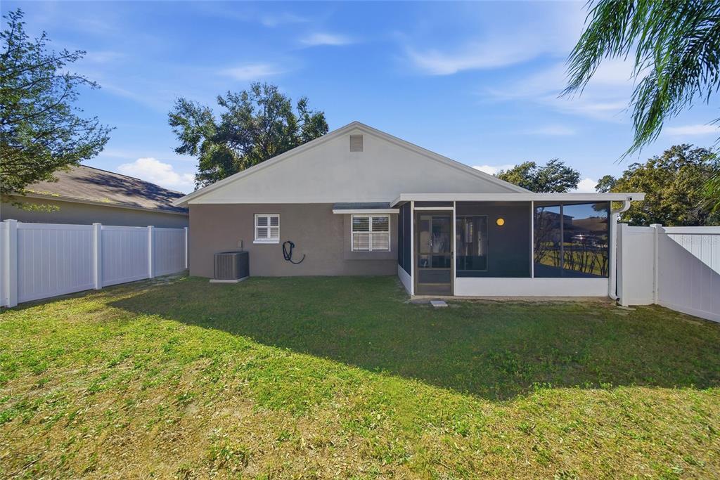 2119 Cattleman Drive Brandon, FL 33511 - Photo 34 of 46 a view of a house with a yard and plants