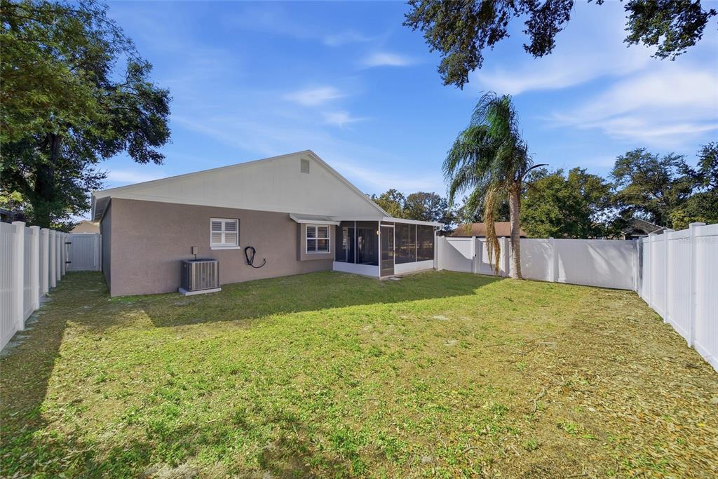 2119 Cattleman Drive Brandon, FL 33511 - Photo 35 of 46 a view of a house with a yard and plants