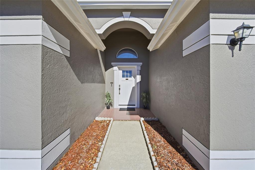 2119 Cattleman Drive Brandon, FL 33511 - Photo 4 of 46 a view of a hallway with wooden floor