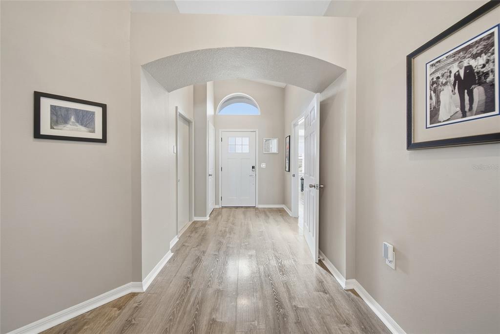 2119 Cattleman Drive Brandon, FL 33511 - Photo 5 of 46 a view of a hallway with wooden floor