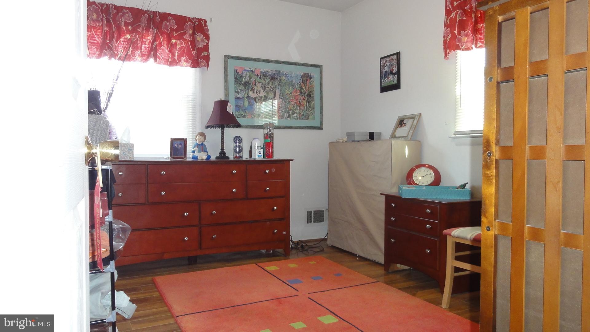 430 Highmeadow Road Reisterstown, MD 21136 - Photo 22 of 36 3rd Bedroom w/Fan & Wood Laminate Floor