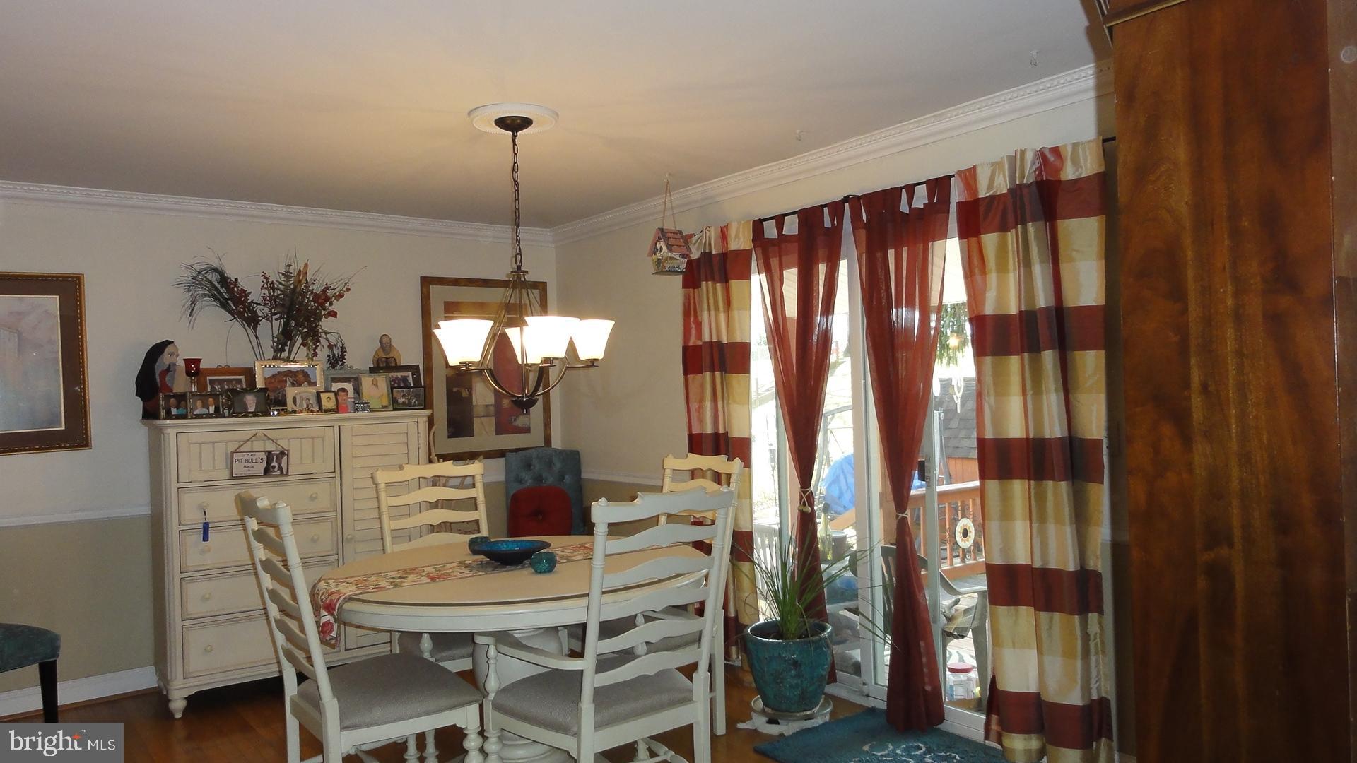 430 Highmeadow Road Reisterstown, MD 21136 - Photo 9 of 36 Dining Room w/Chair Railings & Slider to Deck