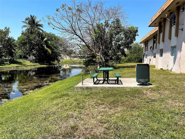 a view of a park with large trees