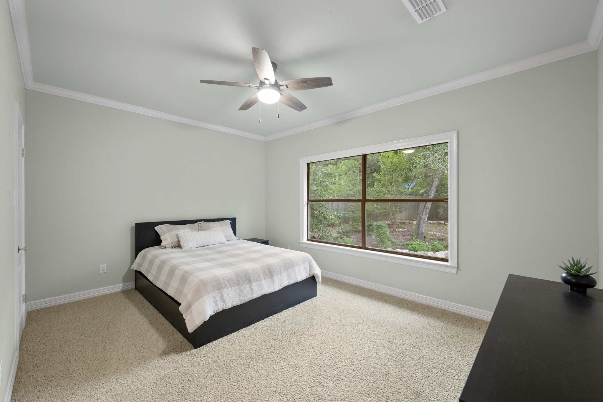 6004 Mt Bonnell Road Austin, TX 78731 - Photo 23 of 24 a bedroom with a bed and a window