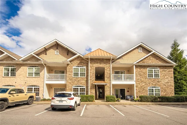 a view of a car parked in front of a building