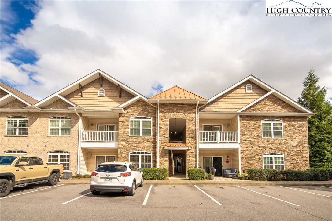a view of a car parked in front of a building