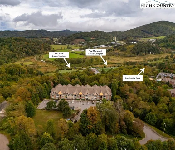 an aerial view of residential houses with outdoor space