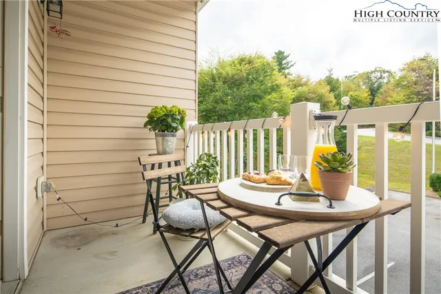a view of a chairs and table in the patio