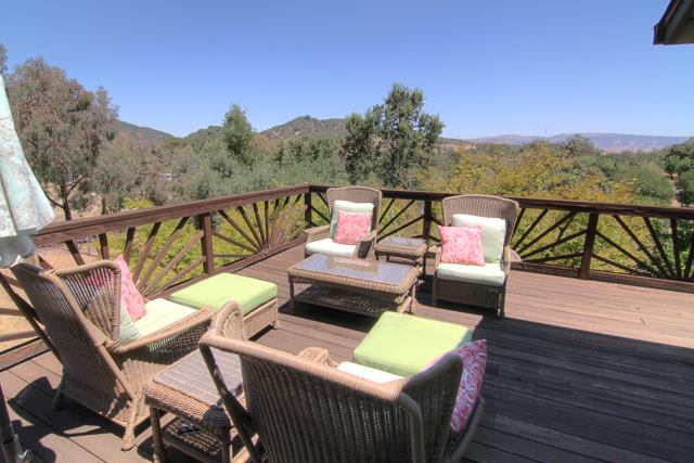 8485 Pharmer Road Gilroy, CA 95020 - Photo 16 of 47 a view of a balcony with wooden floor and outdoor seating