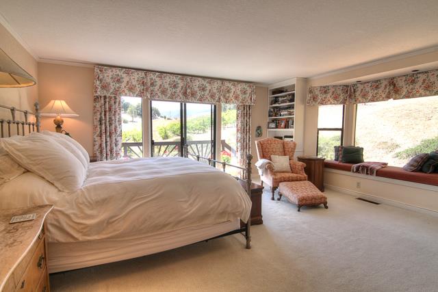 8485 Pharmer Road Gilroy, CA 95020 - Photo 17 of 47 a spacious bedroom with a bed and large windows
