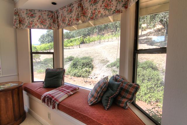 8485 Pharmer Road Gilroy, CA 95020 - Photo 18 of 47 a bed sitting in a bedroom next to a window