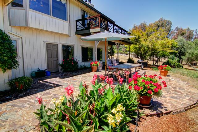 8485 Pharmer Road Gilroy, CA 95020 - Photo 24 of 47 a view of a house with a flower garden