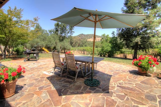 8485 Pharmer Road Gilroy, CA 95020 - Photo 25 of 47 a view of a tables and chairs under an umbrella