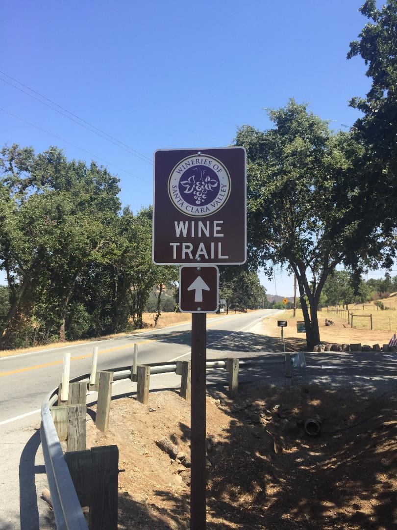8485 Pharmer Road Gilroy, CA 95020 - Photo 47 of 47 a street sign on a sidewalk next to a road