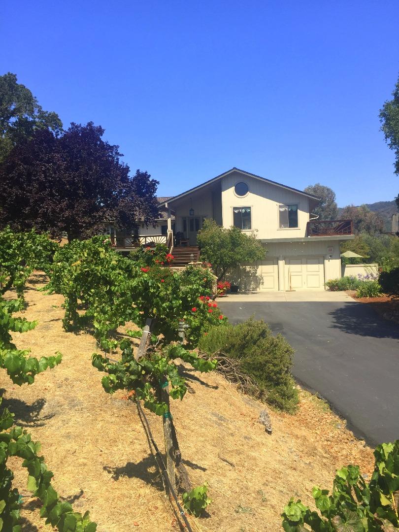 8485 Pharmer Road Gilroy, CA 95020 - Photo 5 of 47 a front view of a house with a yard