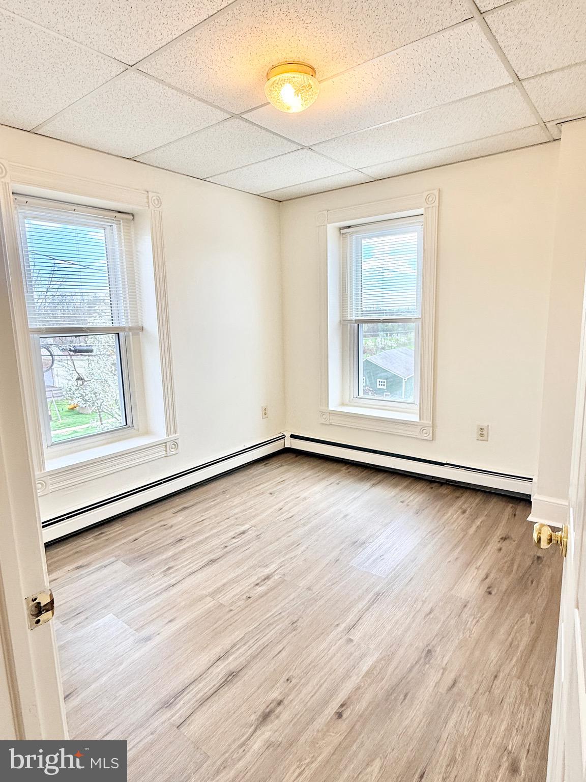 377 West Ridge Pike Royersford, PA 19468 - Photo 13 of 13 an empty room with wooden floor and window