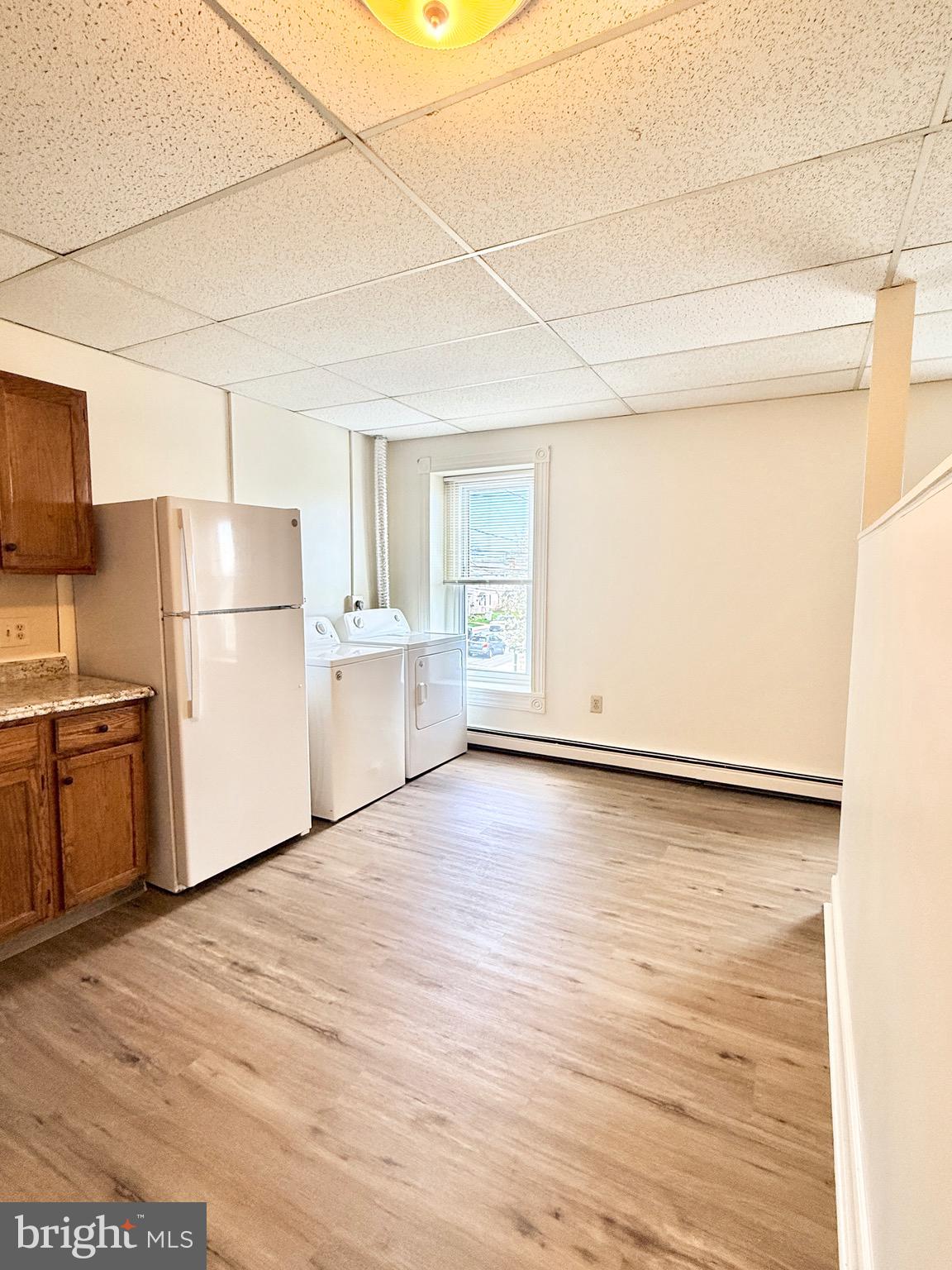 377 West Ridge Pike Royersford, PA 19468 - Photo 5 of 13 a view of a kitchen with wooden floor and a refrigerator