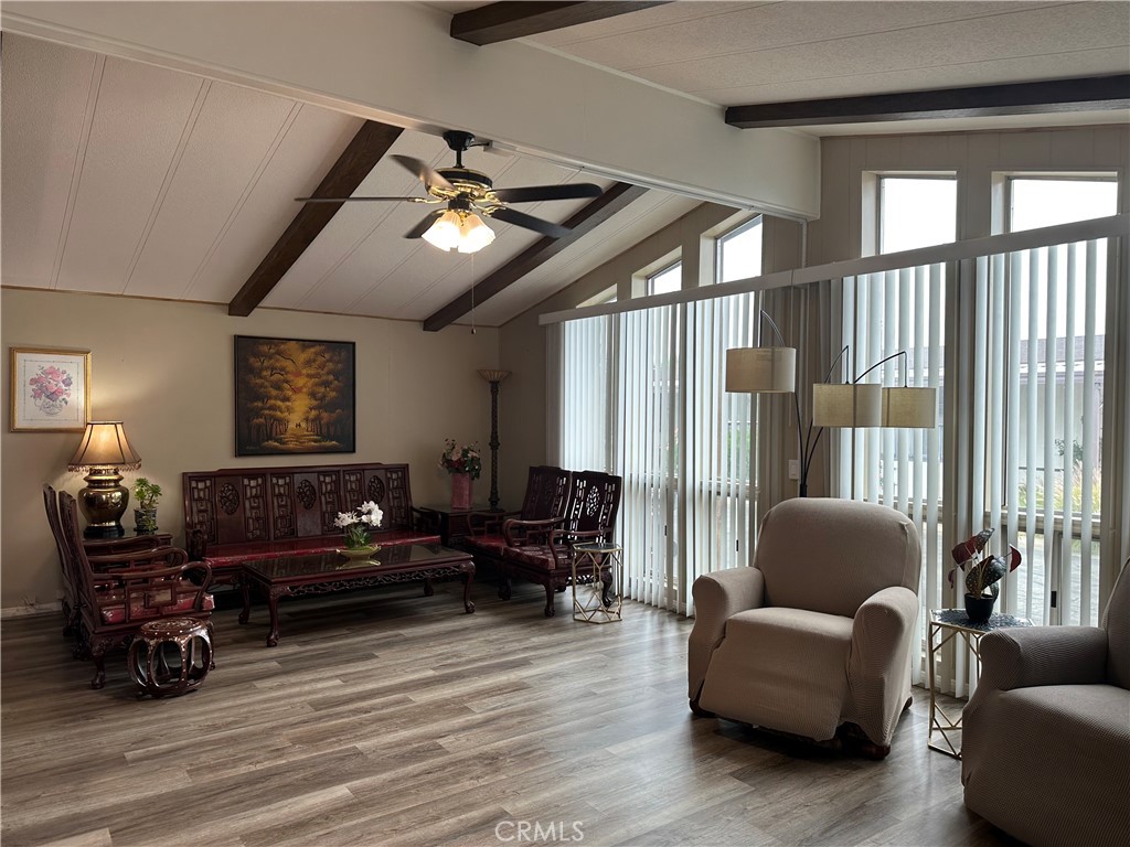 27701 Murrieta Road, Unit 268 Menifee, CA 92586 - Photo 6 of 24 a living room with furniture and wooden floor