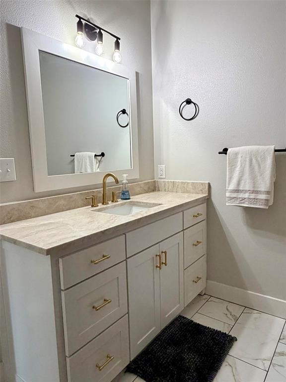 151 Gopher Road Weatherford, TX 76088 - Photo 19 of 22 a bathroom with a sink and a mirror