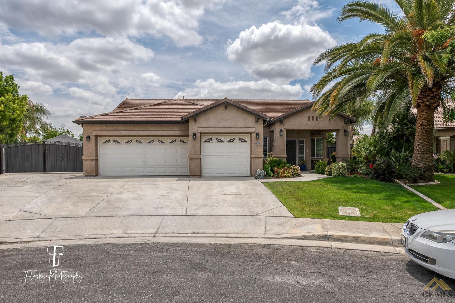 a view of house with yard and entertaining space