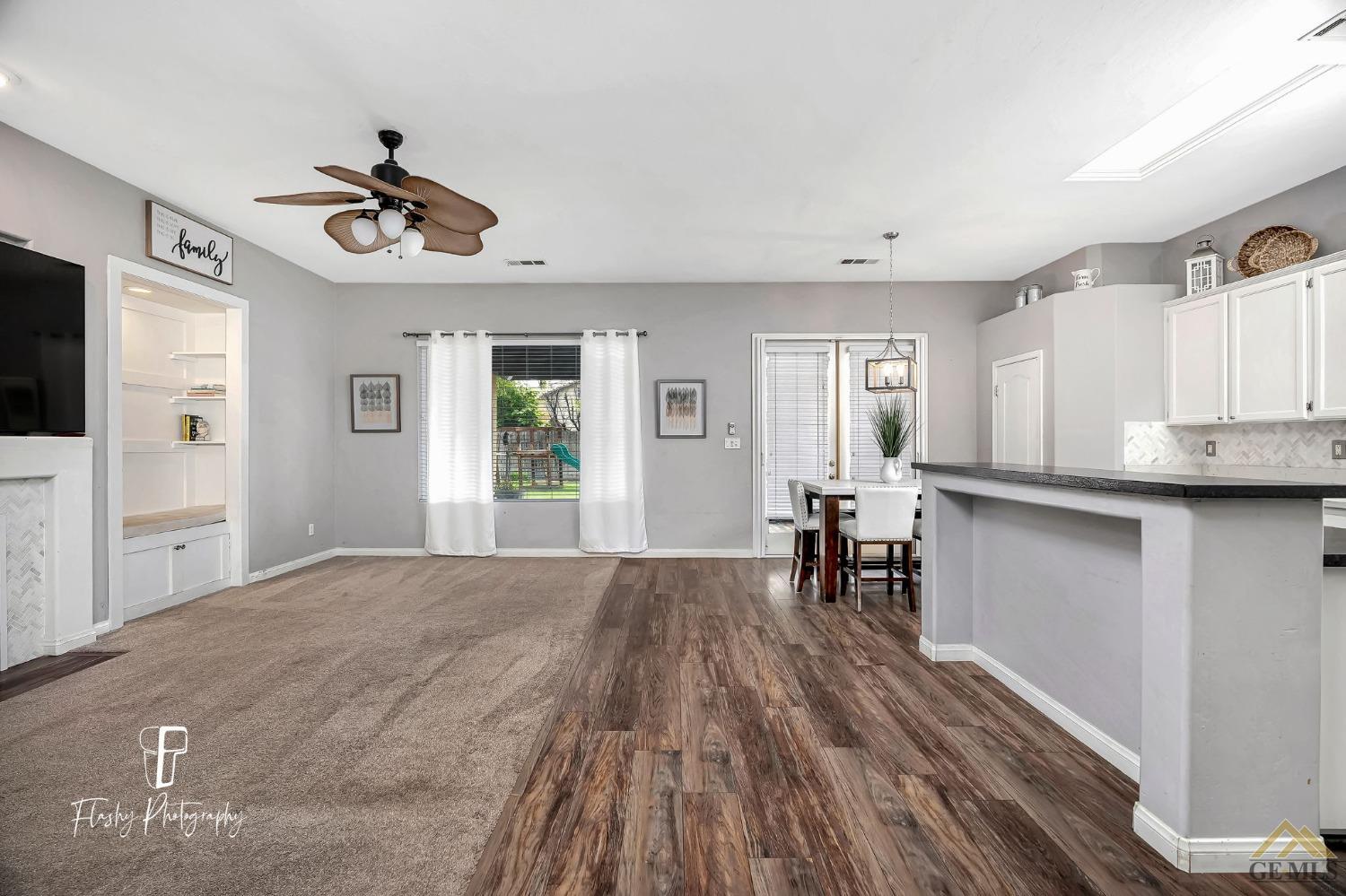 Undisclosed Address Bakersfield, CA 93311 - Photo 12 of 55 a view of empty room with wooden floor and windows