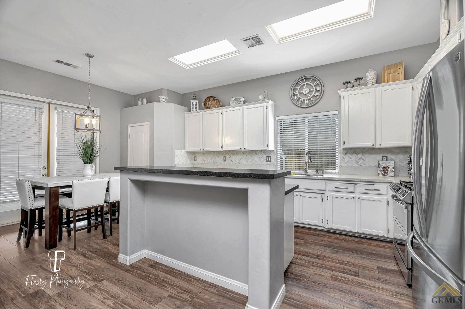 Undisclosed Address Bakersfield, CA 93311 - Photo 13 of 55 a kitchen with a sink cabinets and window
