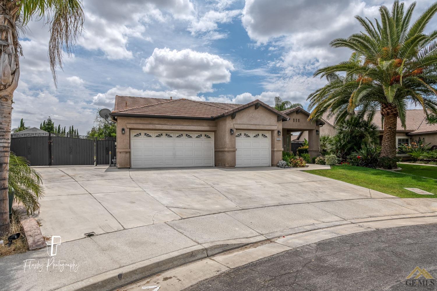Undisclosed Address Bakersfield, CA 93311 - Photo 2 of 55 a view of a white house with a large space and a large space