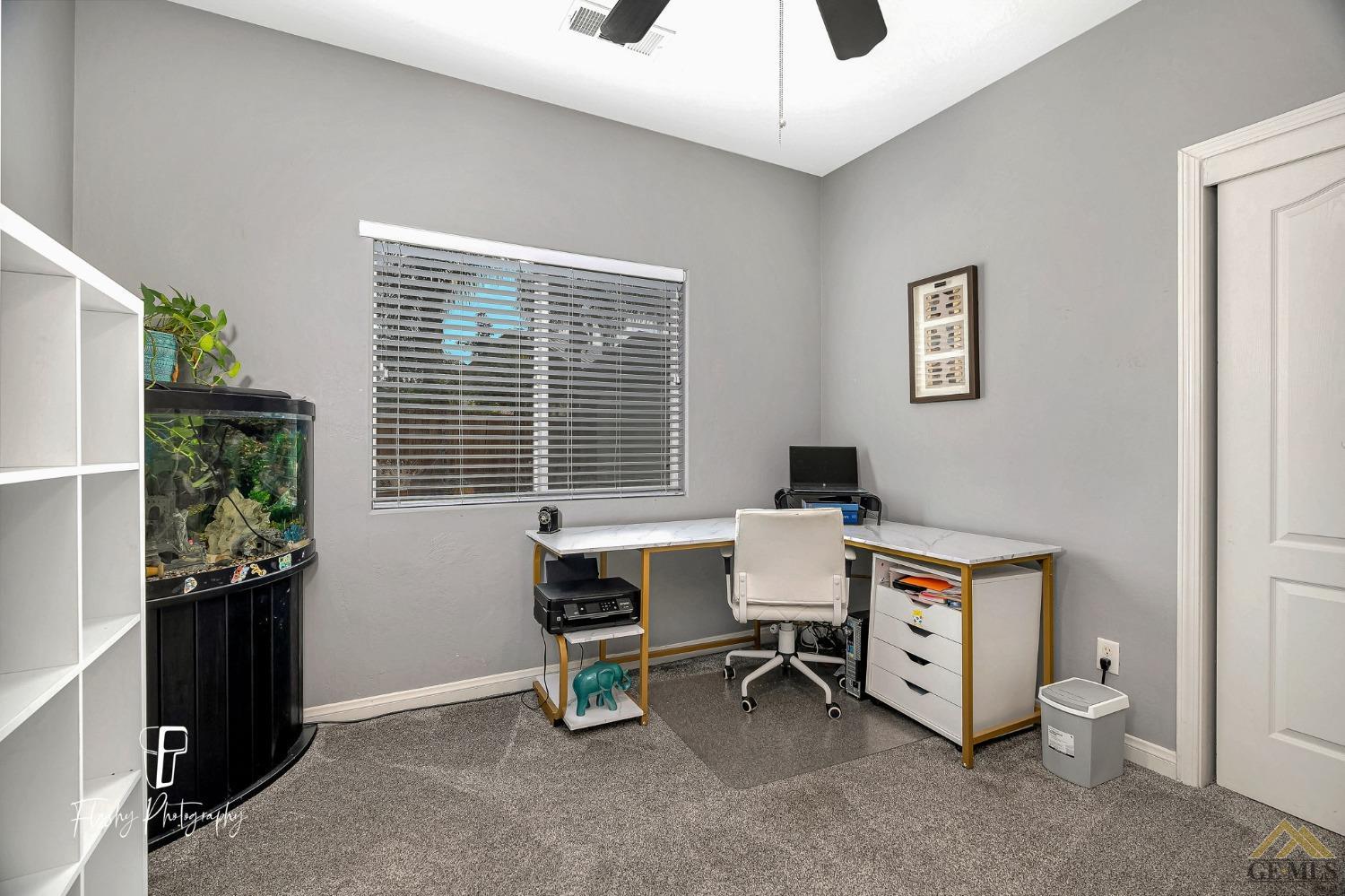 Undisclosed Address Bakersfield, CA 93311 - Photo 22 of 55 a work room with furniture and windows