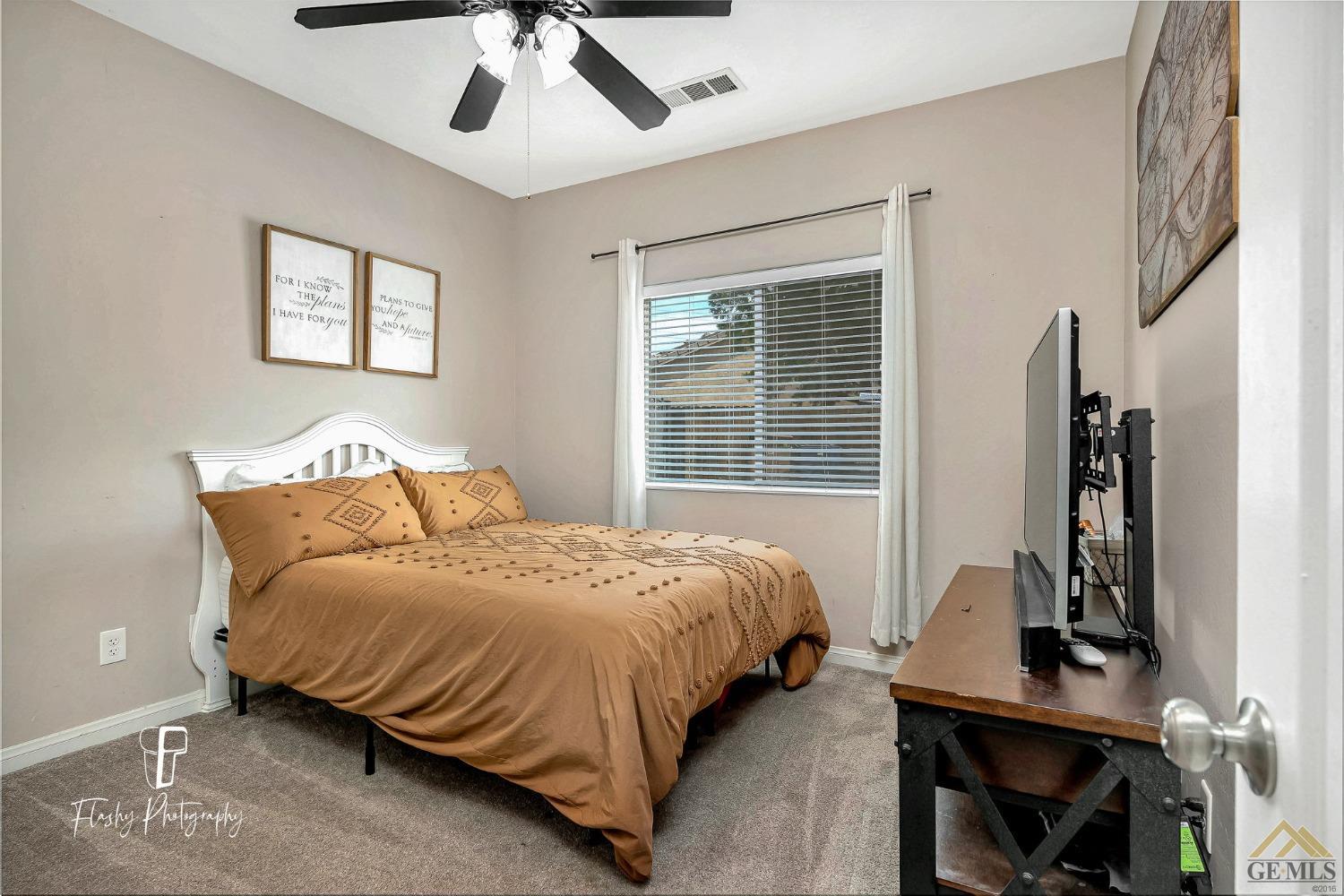 Undisclosed Address Bakersfield, CA 93311 - Photo 24 of 55 a bedroom with bed and a window