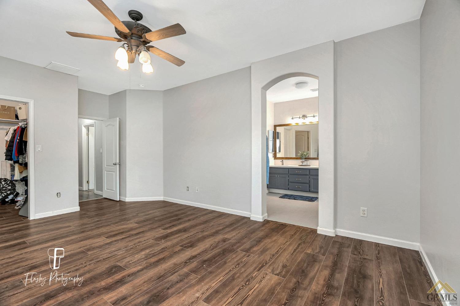 Undisclosed Address Bakersfield, CA 93311 - Photo 28 of 55 wooden floor in an empty room with a window