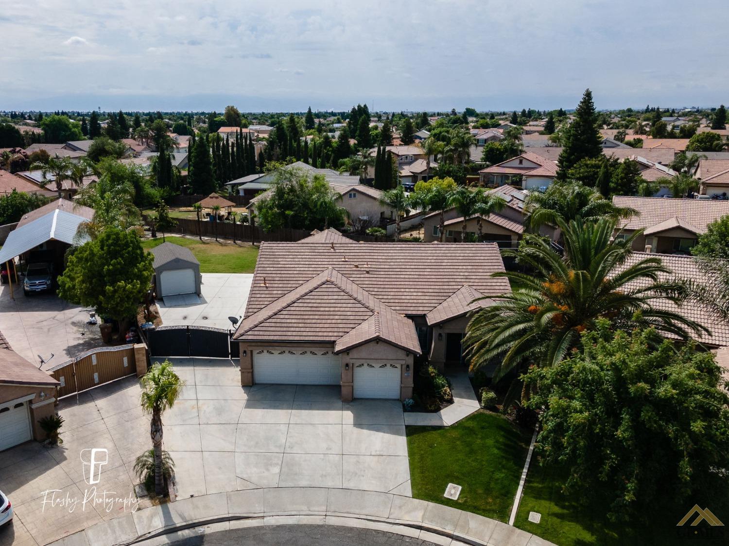 Undisclosed Address Bakersfield, CA 93311 - Photo 32 of 55 an aerial view of a house with a yard basket ball court and outdoor seating