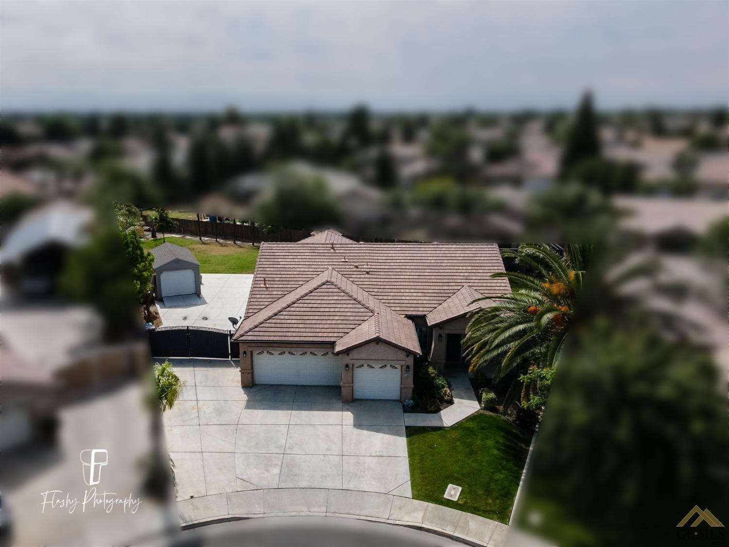 Undisclosed Address Bakersfield, CA 93311 - Photo 33 of 55 an aerial view of a house with yard