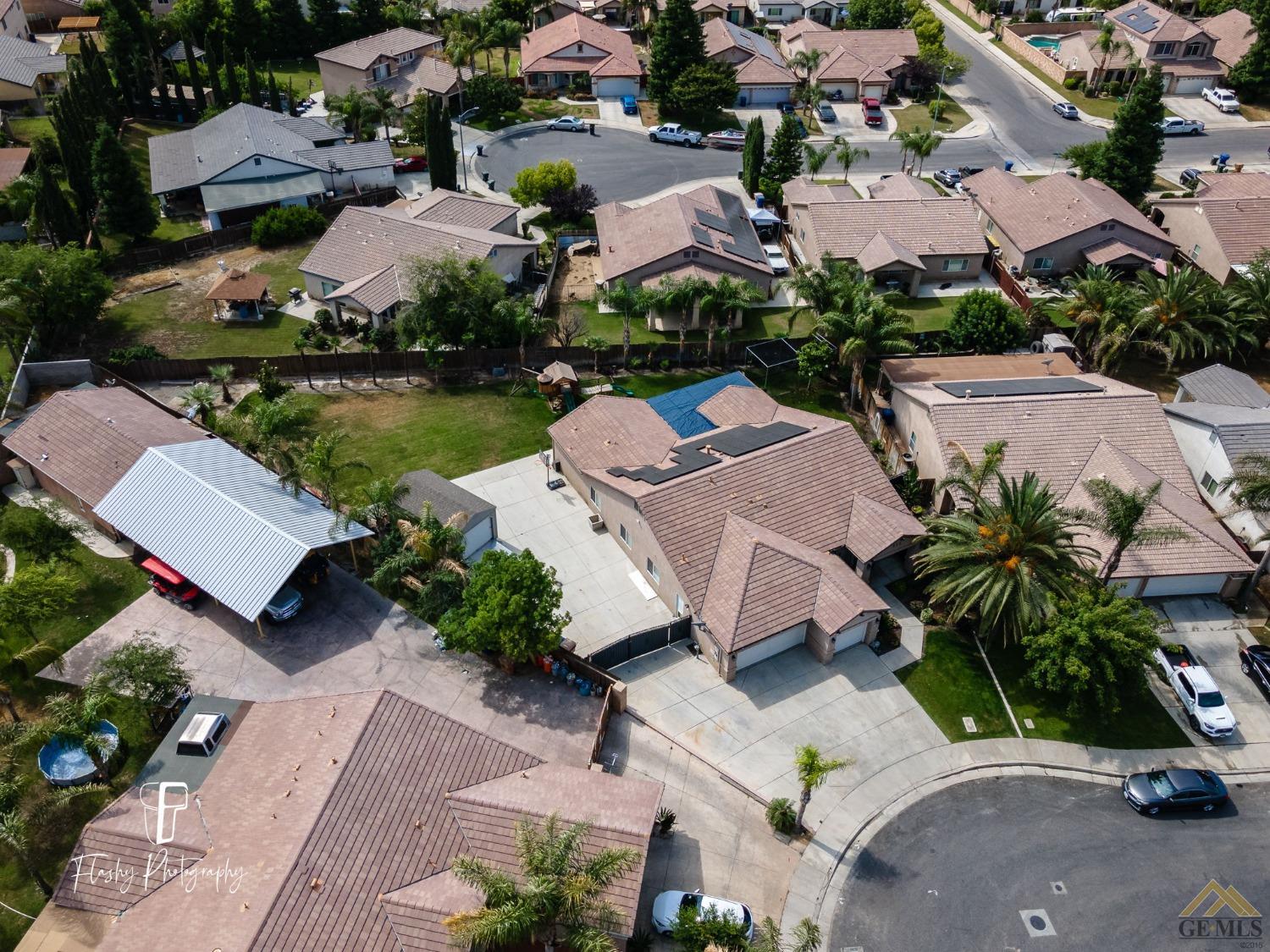 Undisclosed Address Bakersfield, CA 93311 - Photo 39 of 55 an aerial view of a house with garden space and lake view