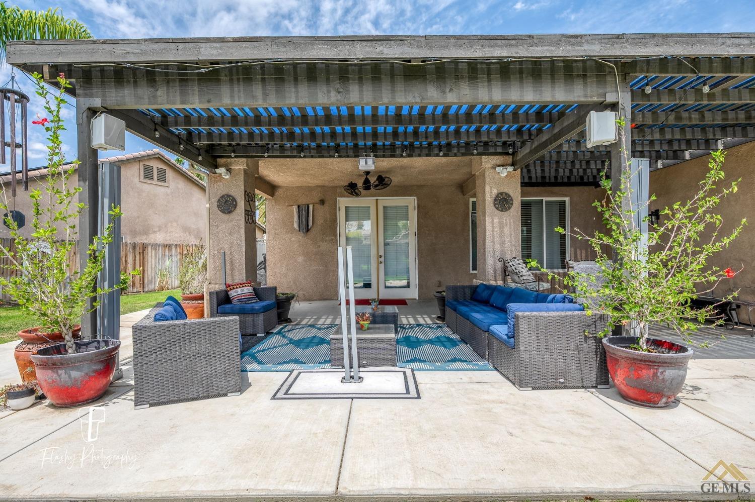 Undisclosed Address Bakersfield, CA 93311 - Photo 40 of 55 a building outdoor space with patio furniture and potted plants