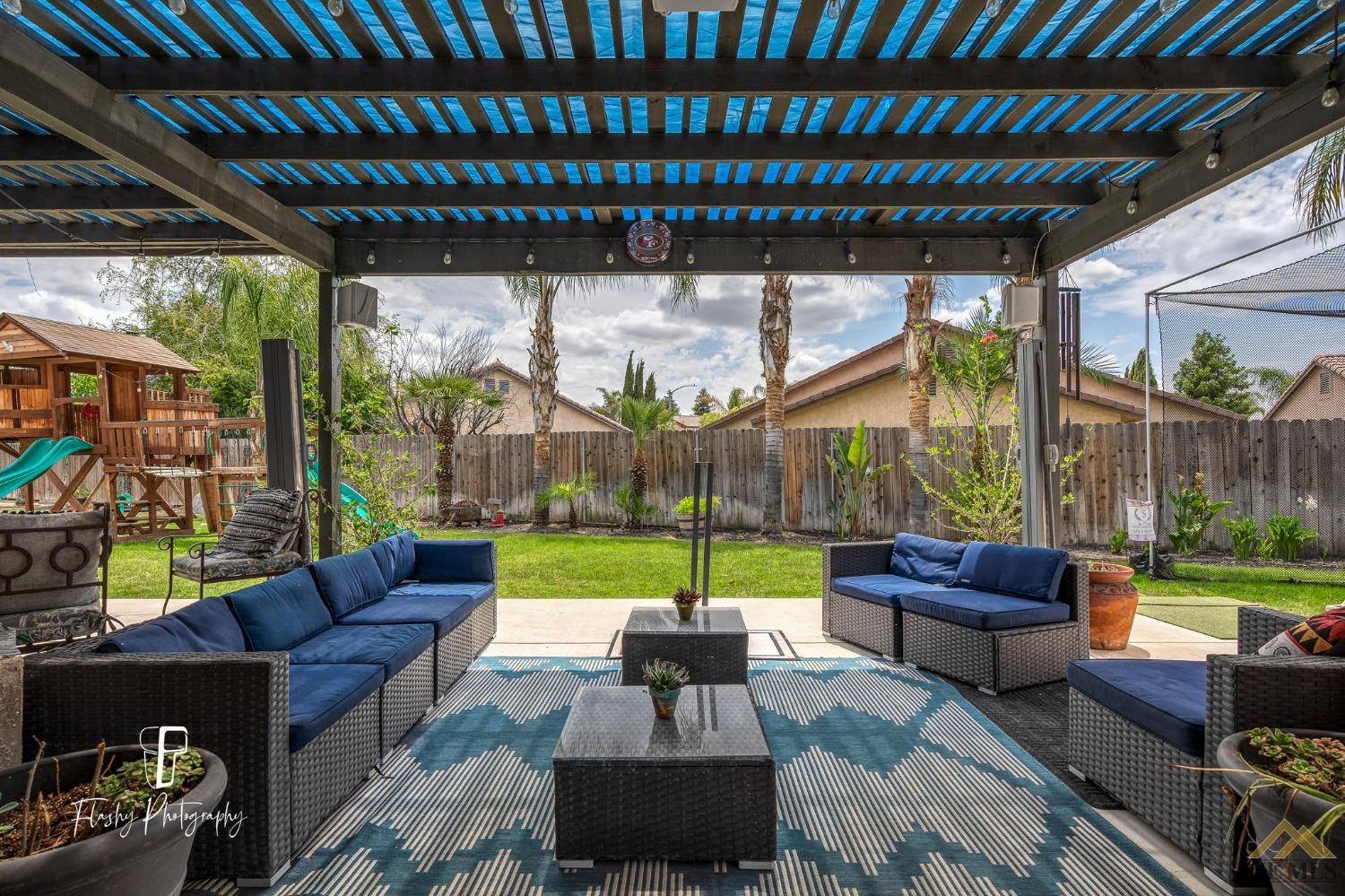 Undisclosed Address Bakersfield, CA 93311 - Photo 41 of 55 a outdoor living space with patio furniture and a garden