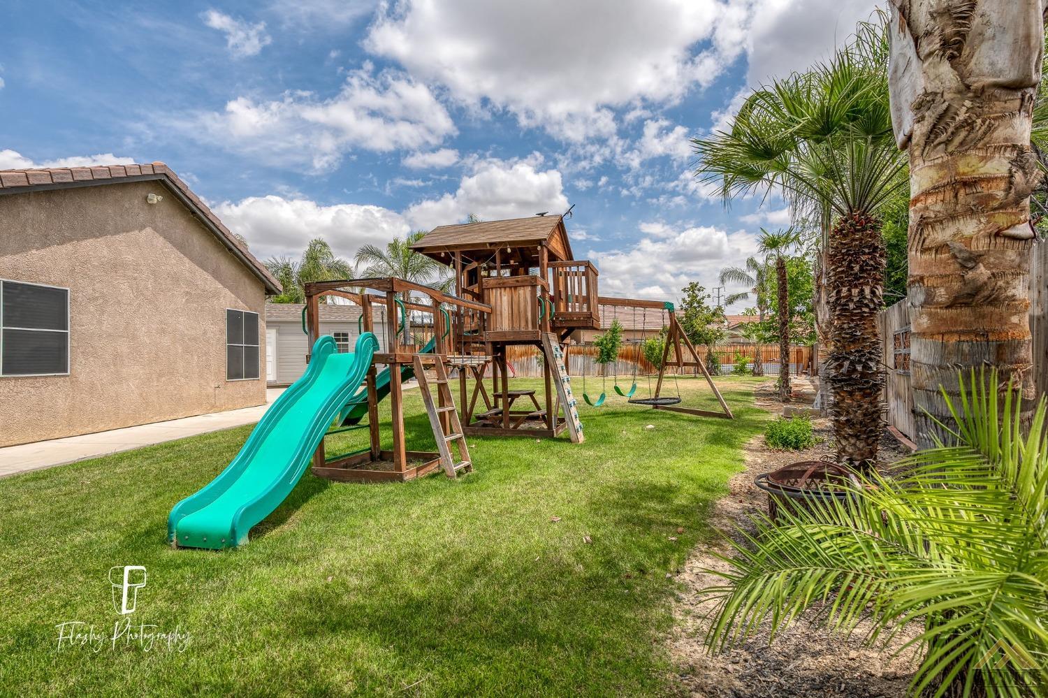 Undisclosed Address Bakersfield, CA 93311 - Photo 47 of 55 a view of a yard with a slide