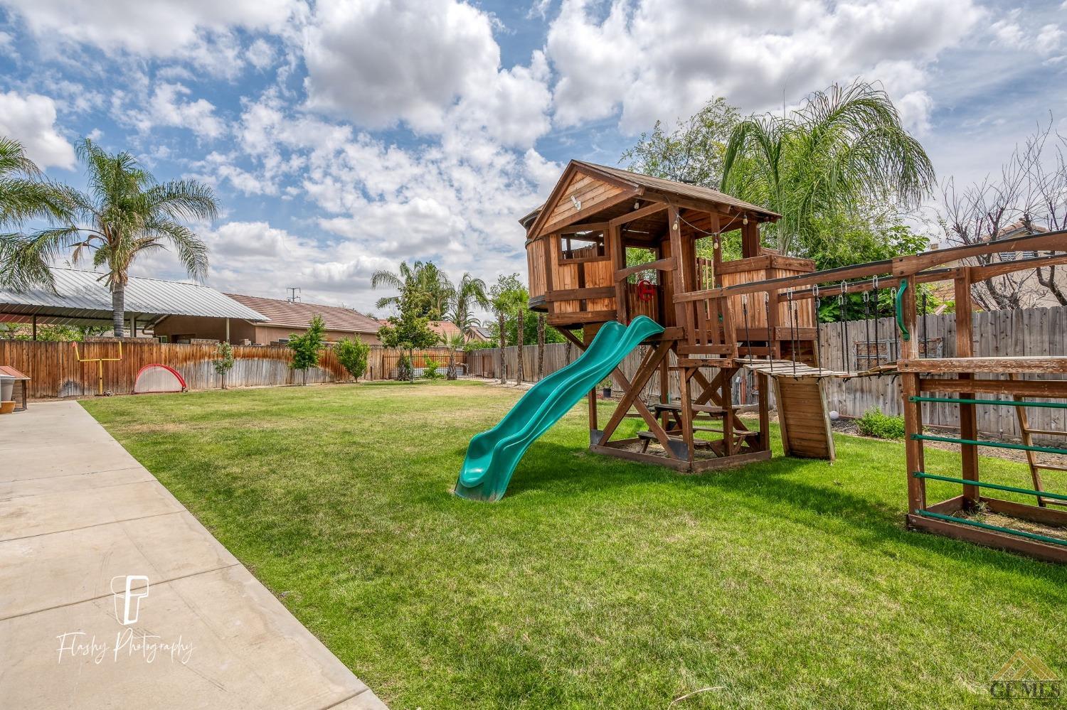 Undisclosed Address Bakersfield, CA 93311 - Photo 48 of 55 a view of a house with a park