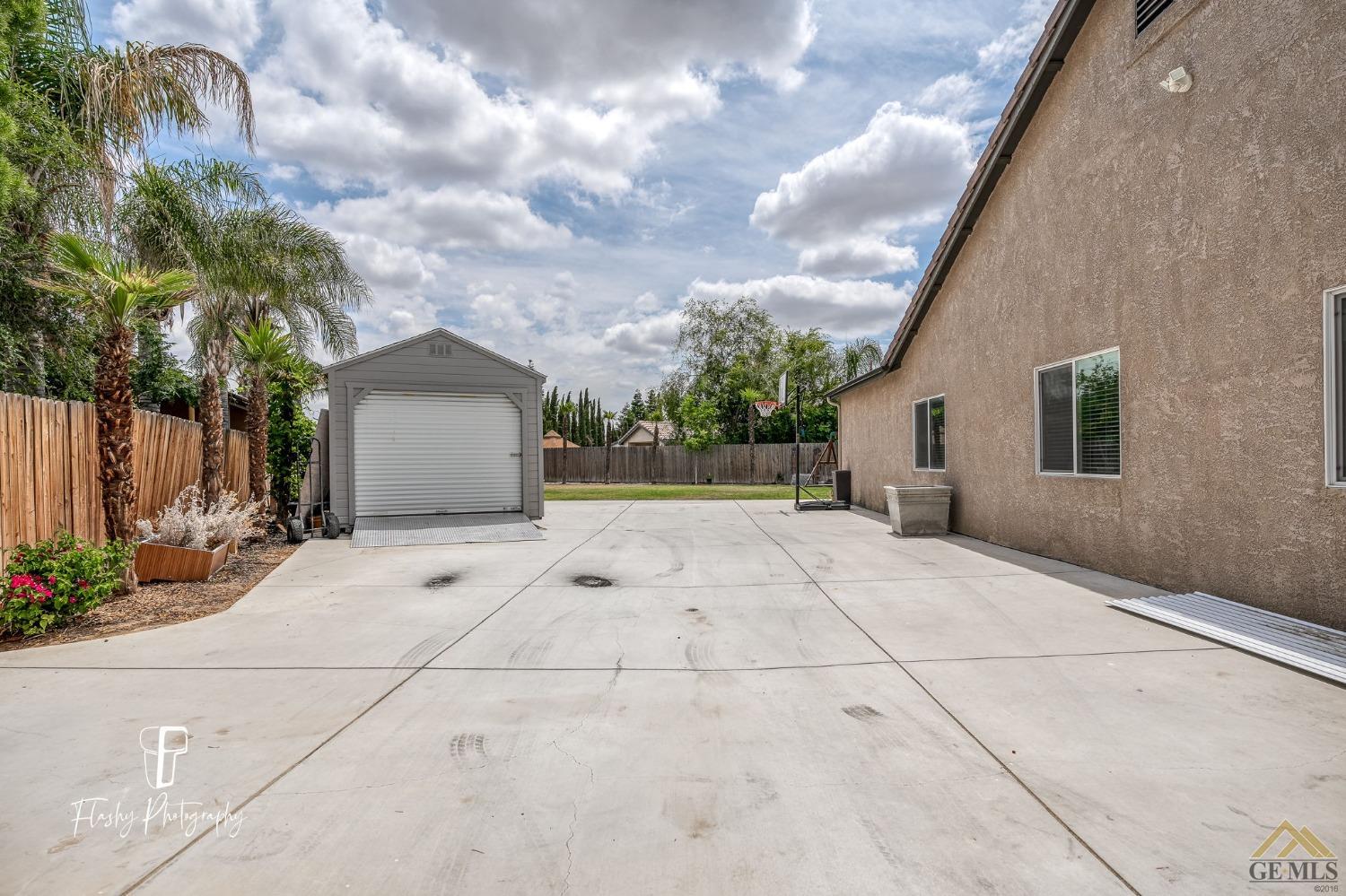 Undisclosed Address Bakersfield, CA 93311 - Photo 55 of 55 a view of a house with a backyard