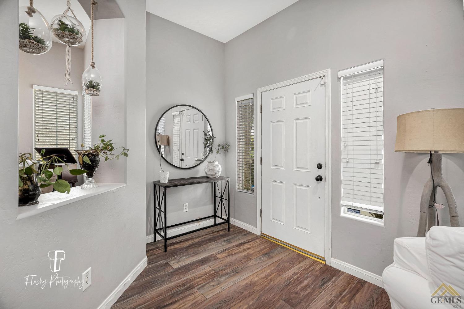 Undisclosed Address Bakersfield, CA 93311 - Photo 6 of 55 a bedroom with a bed a mirror and a window