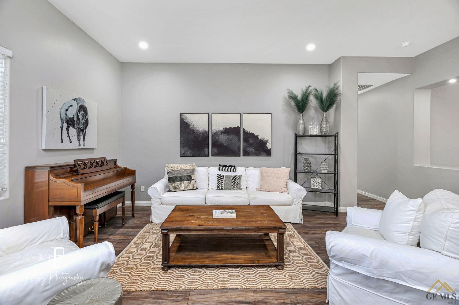 Undisclosed Address Bakersfield, CA 93311 - Photo 9 of 55 a living room with furniture and a flat screen tv