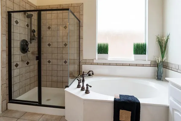 a bathroom with a bathtub and a sink