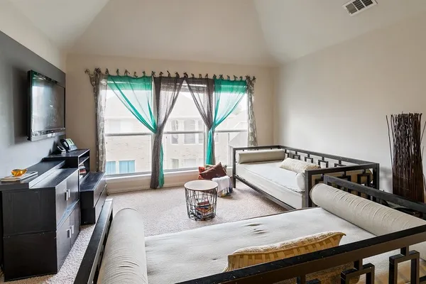 a living room with furniture fireplace and a flat screen tv