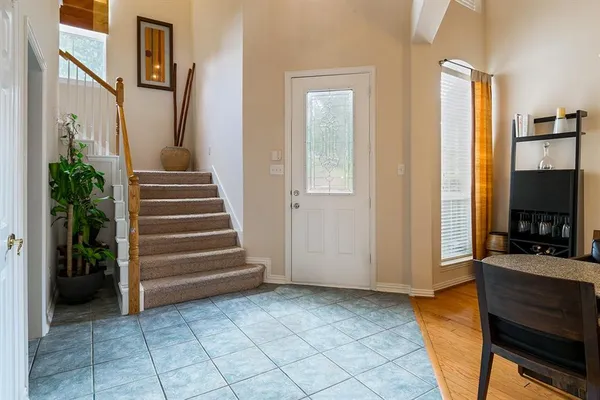 a view of a livingroom with furniture and staircase