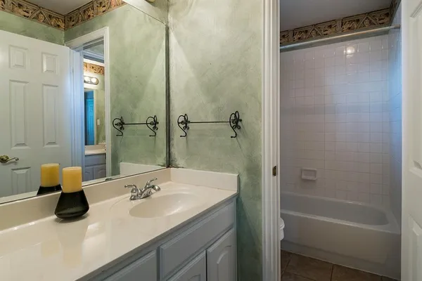 a bathroom with a sink and shower